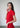 The side view highlights the elegant fit and ribbed texture of the red top. The modern silhouette and vibrant color enhance its contemporary appeal.